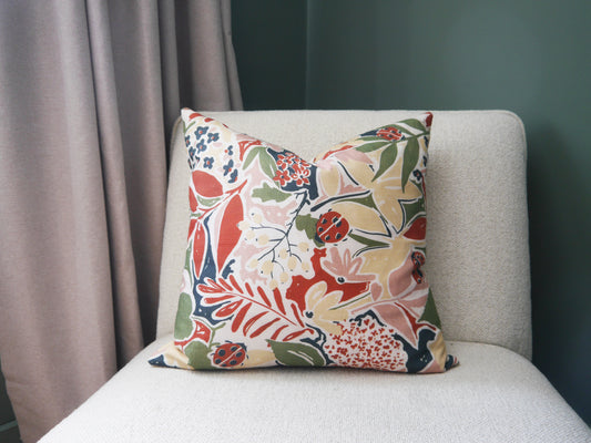 Nature's Delight Cushion: Ladybirds, Leaves, and Buds